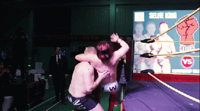 Middle-Kingdom-Wrestling-MKW-Big-Sam-slams-Selfie-King-Hong-Wan-hard-on-ring-apron.gif